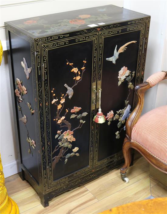 A Chinese black lacquered two door cupboard, inset hardstones, W.67cm